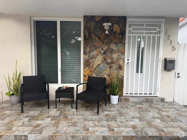 Front part of the house with a private gated entrance to backyard - 1115 NW 32nd Ave