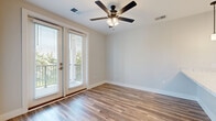 This well-appointed one-bedroom, one-bathroom residence at 484 Lazelle Road in Columbus, Ohio offers a thoughtfully designed single-floor layout with clean, modern finishes throughout. Wood-look flooring flows seamlessly from the entrance through the living room and kitchen, creating a cohesive and easy-to-maintain living space.

The kitchen is a standout feature, showcasing crisp white shaker cabinetry with matte black hardware, light marbled countertops, a classic subway tile backsplash, and a full suite of stainless steel appliances including a refrigerator, range, over-the-range microwave, and dishwasher. A peninsula with pendant lighting above adds both functionality and style, making it ideal for casual dining or entertaining.

The living area is bright and open, benefiting from a ceiling fan with integrated lighting and a glass door that invites natural light and provides outdoor access. The bedroom offers plush carpeting underfoot, a ceiling fan, and a window with views of greenery, creating a calm and comfortable retreat. Two closets provide ample storage throughout the unit.

The bathroom features white cabinetry with matching hardware, a marbled vanity top, and a full tub-shower combination. A dedicated laundry area adds everyday convenience. The overall palette of soft neutrals and white trim lends the space a clean, modern aesthetic.