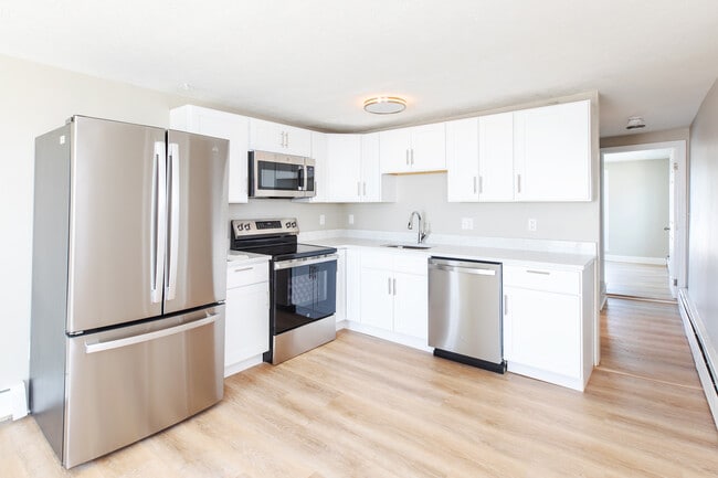 Fully updated kitchen with modern cabinets and appliances. - 487 Ocean Blvd