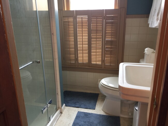 tile bathroom with linen closet - 130 Park Pl