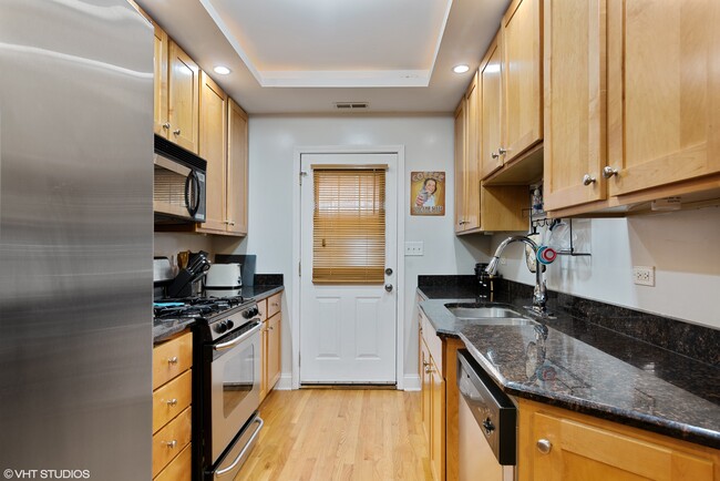 Plenty of storage and granite counter space in the kitchen! - 6969 N Wolcott Ave