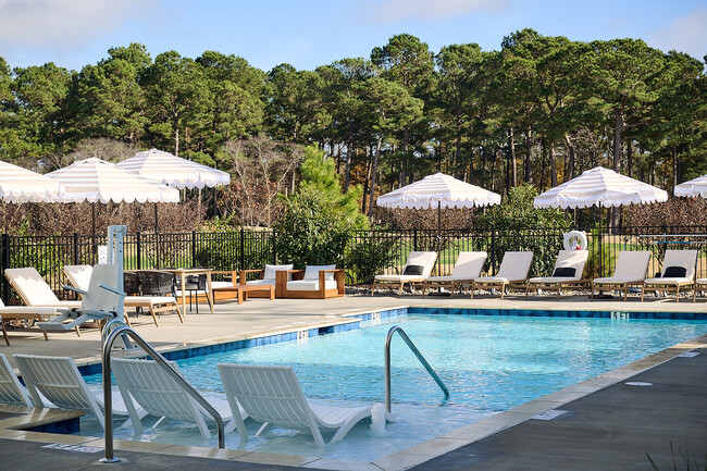 Experience relaxation at its finest with this serene poolside escape, perfect for sunbathing and refreshing dips. - The View at Crow Creek