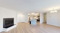 Located at 341A Fieldpointe Blvd in Frederick, Maryland, this single-floor residence offers a well-designed layout with modern finishes throughout. The kitchen is a standout feature, showcasing gray shaker-style cabinetry, granite countertops, a central island for additional prep and dining space, and a full suite of stainless steel appliances including a refrigerator, range, microwave, and dishwasher. A subway tile backsplash and light wood-style flooring complete the polished look.

The open living and dining areas are bright and welcoming, featuring the same light wood-style flooring, neutral walls, and a stylish chandelier in the dining space. A sliding glass door floods the living room with natural light and provides direct access to an outdoor area, offering pleasant exterior views.

The bedrooms are comfortably appointed with plush carpeting, neutral tones, and ample natural light from well-placed windows. Closet space is thoughtfully incorporated, and the layout provides a sense of privacy and comfort. A bathroom with updated fixtures rounds out the interior. Throughout the residence, clean lines, a cohesive neutral palette, and quality finishes create a bright, functional, and inviting living environment.