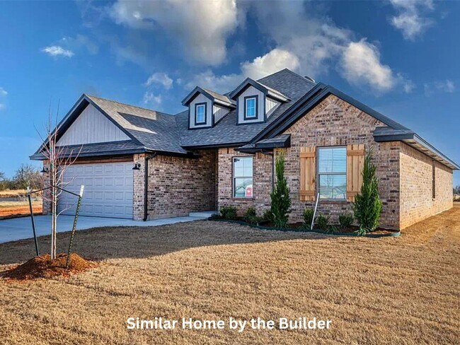 Foto del edificio - Spacious 4-Bedroom Home with 3-Car Garage in Yukon!