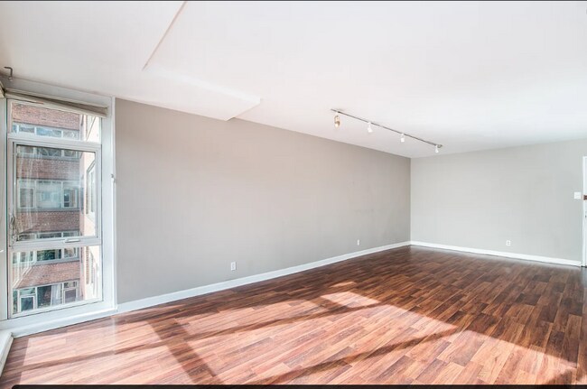 Building Photo - Bright fifth-floor one-bedroom in the heart of Dupont Circle with floor-to-ceiling windows and an...