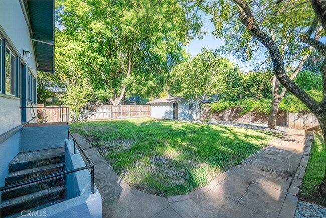 view of backyard with basement entrance - 595 E 3rd St