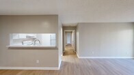 This well-designed 1040 square foot home in Charlotte, NC offers a comfortable living space with 3 bedrooms and 2 bathrooms. The single-story layout maximizes functionality, featuring a spacious primary bedroom of 190 square feet. The open-concept living area showcases light wood-tone flooring, creating a bright and airy atmosphere. Neutral wall colors throughout provide a versatile backdrop for various decor styles.

The bathrooms are equipped with modern white fixtures, including a shower-tub combination with built-in storage niches. The kitchen area, while not fully visible, appears to be integrated into the main living space, promoting a fluid layout ideal for entertaining. Large windows and a sliding glass door in one room allow ample natural light to flood the interior.

Bedrooms feature plush carpeting for comfort, and the home includes practical amenities such as a dedicated laundry area. Built-in closets with wire shelving systems offer organized storage solutions. The property's thoughtful design maximizes space efficiency, making it an ideal choice for those seeking a contemporary, low-maintenance home in a desirable Charlotte neighborhood.