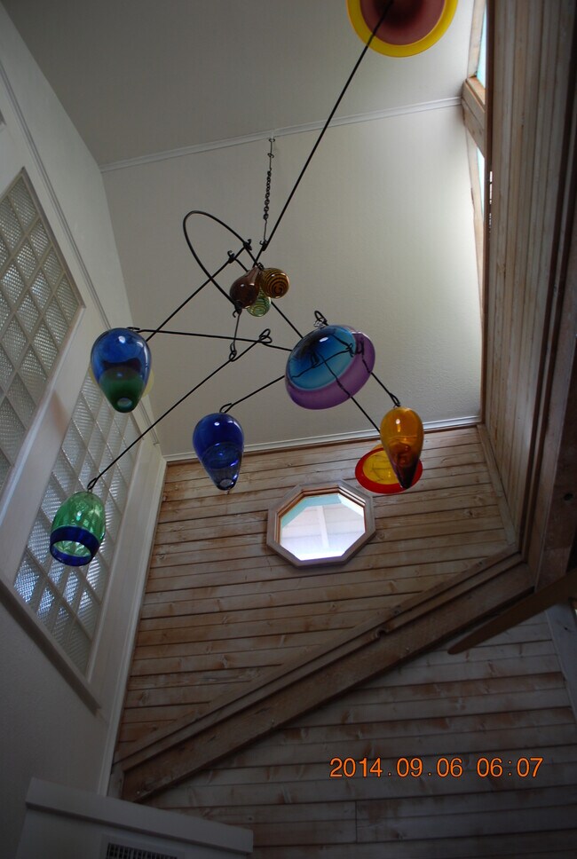 Custom made blown glass mobile hangs in bedroom #2. - 514 Deep Eddy Ave