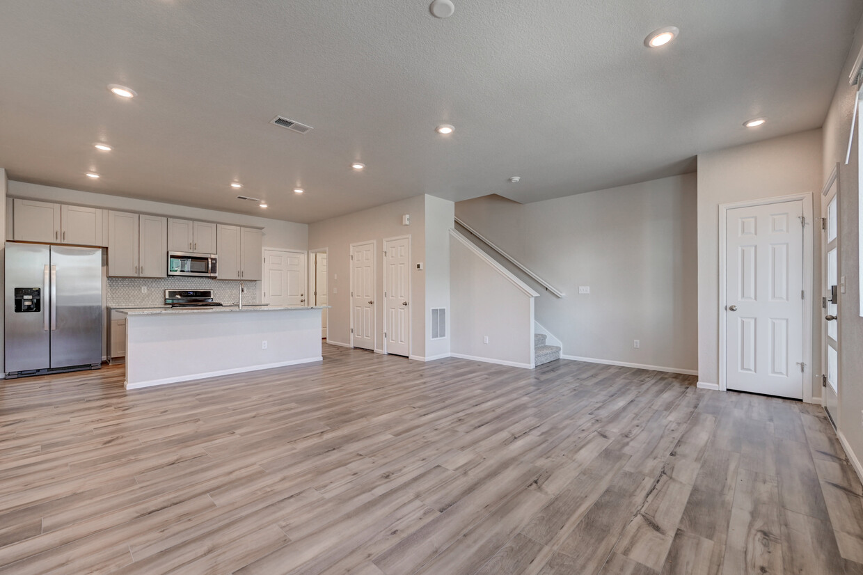 Main level open floor plan - Living room, dining, kitchen - 6383 N Malaya St