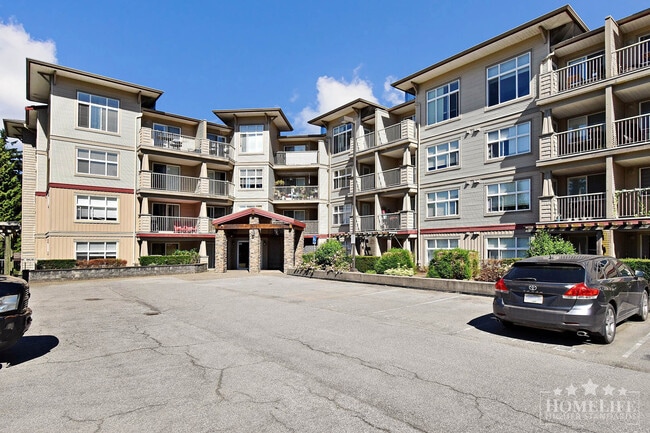 Building Photo - Modern 1 Bedroom + Den Condo with Mountain Views in Prime Abbotsford Location