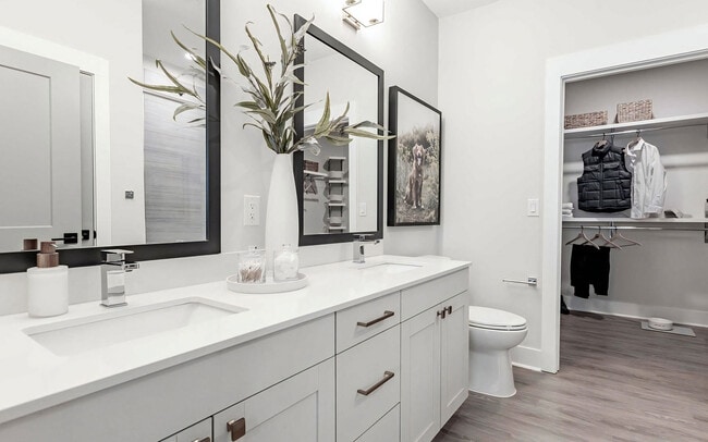 Luxurious bathroom with double vanity and spacious walk-in closet - Sinclair Cary