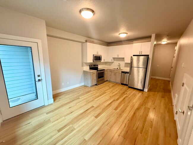 Unidad 7 Cocina / Sala de estar - Stafford Apartments