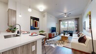 Located at 222 W Boston St in Chandler, AZ, this single-story, two-bedroom, two-bathroom residence offers a well-designed open-concept layout with wood-style flooring throughout. The kitchen is a standout feature, equipped with stainless steel appliances including a French-door refrigerator, built-in microwave, and range. Light wood cabinetry extends to the ceiling, maximizing storage, while a peninsula with a white quartz countertop and bar seating provides an ideal dining and gathering space. Pendant lighting overhead adds a polished finishing touch. The living room flows naturally from the kitchen, featuring elevated ceilings, a ceiling fan, and a sliding glass door that opens to a private patio with outdoor views. Both bedrooms are comfortably sized — the primary bedroom includes a walk-in closet and generous natural light from large windows. The two bathrooms are finished with wood-toned vanities and tub-shower combinations. A dedicated laundry area houses a full-size washer and dryer. With four closets total and a thoughtful floor plan, this residence offers practical functionality alongside a clean, contemporary aesthetic suited for everyday living in Chandler, Arizona.