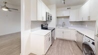 Located in Millcreek, Utah, this two-bedroom, one-bathroom unit offers a clean, modern layout thoughtfully finished throughout. The open living room features durable wood-look flooring, a ceiling fan with light fixture, and a sliding glass door that fills the space with natural light and provides outdoor access. The kitchen is well-appointed with white shaker cabinetry, light grey subway tile backsplash, stainless steel appliances including a range, microwave, and dishwasher, plus a stainless steel sink and in-unit washer. Light wood-look flooring continues through the kitchen for a cohesive look. Both bedrooms are carpeted and bright, each featuring windows with blinds and ceiling fans for comfort. The primary bedroom includes a built-in closet, while the second bedroom also offers closet storage. Hallways connect the rooms efficiently, contributing to a well-organized floor plan. The bathroom is neatly finished with a white vanity, wood-look flooring, and a tiled tub-shower combination accented by grey subway tiles, complemented by a frosted window for natural light and privacy. Overall, the unit presents a fresh, functional living environment in a convenient Millcreek location.