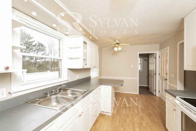 Building Photo - Turn the key. Enter. Smile. Repeat every day!