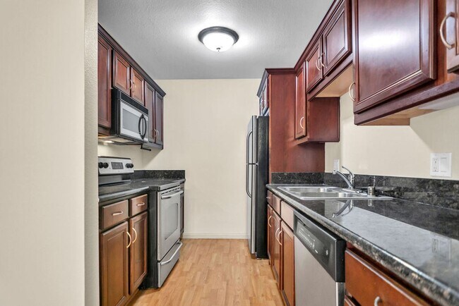 Building Photo - Available now! Great 2/1 condo close to SD...