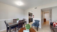 Located at 5605 Chimney Rock Rd in Houston, TX, this thoughtfully laid-out 2-bedroom, 1-bathroom residence makes efficient use of its single-floor footprint. Light gray walls, tile flooring throughout, and textured ceilings create a clean, cohesive aesthetic across the space.

The combined dining and living area serves as the heart of the home, featuring a classic chair rail detail along the walls and French doors that invite natural light while offering a pleasant outdoor view. The galley-style kitchen is well-appointed with dark cabinetry, subway tile backsplash, granite-look countertops, and black appliances including a range and dishwasher. A dedicated pantry adds practical storage.

The spacious primary bedroom connects to a hallway leading back toward the main living area, with three closets distributed throughout the unit for ample storage. The second bedroom features a distinctive white painted brick accent wall, adding character and texture to the room. The shared full bathroom includes a tiled tub-shower combination with floor-to-ceiling tile surround and chrome fixtures.

With three closets, a pantry, and a practical layout, this residence in Houston's Westheimer corridor offers a functional and comfortable living environment.