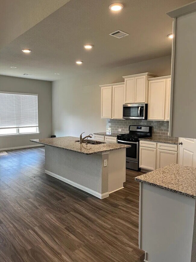 Building Photo - Four bedroom home with dedicated home office, game room, 2.5 bathrooms, and fenced yard in Fairwa...