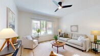 Located at 4312 Vista Ave in St. Louis, MO, this well-appointed 2-bedroom, 1-bathroom unit offers a thoughtfully designed single-floor layout with a clean, modern aesthetic throughout. Light hardwood flooring flows seamlessly from room to room, complementing the crisp white walls and creating a bright, cohesive feel.

The open-concept kitchen and living area serves as the heart of the home. The kitchen is outfitted with white shaker-style cabinetry reaching toward the ceiling, stainless steel appliances, a white quartz countertop, and a central island with seating for two — ideal for casual dining or entertaining. Pendant lighting above the island adds a modern industrial touch, while recessed lighting ensures the space is well lit throughout.

The living room benefits from large windows that invite abundant natural light and offer views of the surrounding neighborhood. A ceiling fan overhead adds comfort and function to the space.

Both bedrooms are serene and restful, featuring hardwood floors, generous natural light, and ceiling fans. The primary bedroom includes a large window with outdoor views, enhancing the airy atmosphere. The full bathroom is finished in clean white tile with a modern vanity, framed mirror, and a shower-tub combination, maintaining the home's consistent contemporary style.