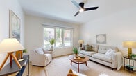 Located at 4312 Vista Ave in St. Louis, MO, this well-appointed 2-bedroom, 1-bathroom unit offers a thoughtfully designed single-floor layout with a clean, modern aesthetic throughout. Light hardwood flooring flows seamlessly from room to room, complementing the crisp white walls and creating a bright, cohesive feel.

The open-concept kitchen and living area serves as the heart of the home. The kitchen is outfitted with white shaker-style cabinetry reaching toward the ceiling, stainless steel appliances, a white quartz countertop, and a central island with seating for two — ideal for casual dining or entertaining. Pendant lighting above the island adds a modern industrial touch, while recessed lighting ensures the space is well lit throughout.

The living room benefits from large windows that invite abundant natural light and offer views of the surrounding neighborhood. A ceiling fan overhead adds comfort and function to the space.

Both bedrooms are serene and restful, featuring hardwood floors, generous natural light, and ceiling fans. The primary bedroom includes a large window with outdoor views, enhancing the airy atmosphere. The full bathroom is finished in clean white tile with a modern vanity, framed mirror, and a shower-tub combination, maintaining the home's consistent contemporary style.