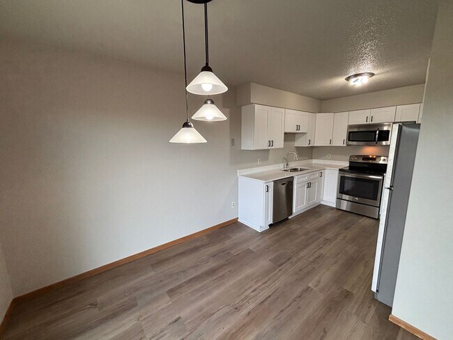 Building Photo - Quiet Neighborhood Gem: Updated 3BR Townhome with Garage & Yard