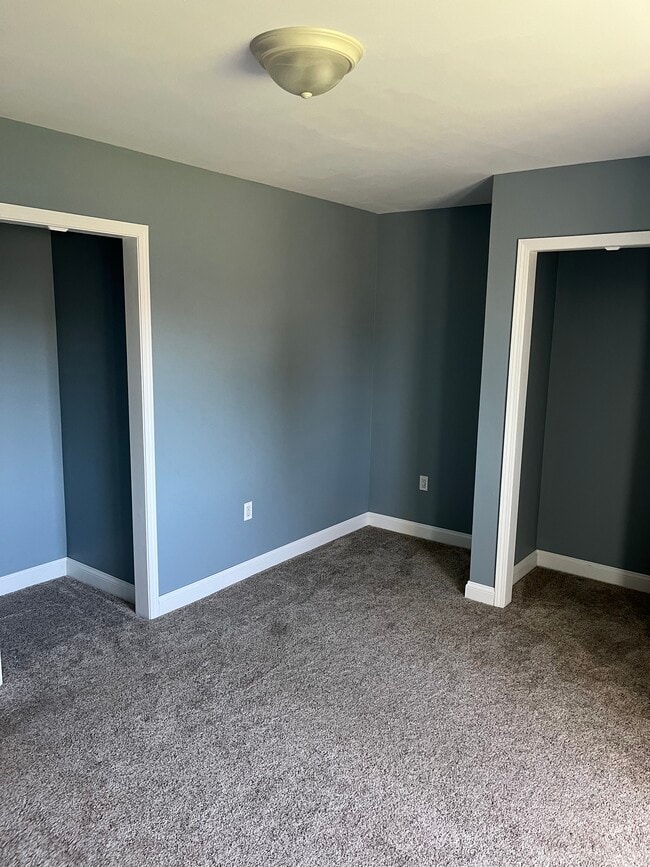 Bedroom 1 featuring 2 closets - 53314 Zachary Dr