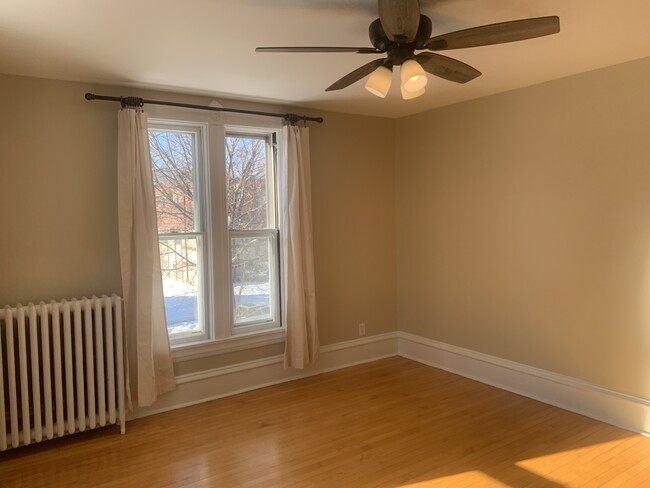 Bedroom or living area 2 (larger); hardwood floors, fresh paint - 2645 Colfax Ave S