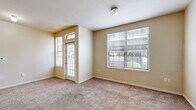 Located at 100 Park Dr in Maumelle, Arkansas, this single-floor, 2-bedroom, 1-bathroom residence offers a practical and well-organized layout. The living room greets you at the front entry, featuring plush carpeting, warm neutral-toned walls, and generous natural light streaming through multiple windows, including a transom-lit front door. The space feels open and inviting, ideal for both relaxing and entertaining. The kitchen is equipped with warm wood cabinetry, a tile-top counter peninsula, hardwood-style flooring, and white appliances including a refrigerator, range, and over-the-range microwave, with pendant lighting adding a functional touch overhead. The full bathroom features a tiled tub-shower combo, wood-style flooring, and a vanity with a blue-gray countertop. The primary bedroom is a comfortable size, with carpeted flooring and access to a dedicated walk-in closet outfitted with wire shelving and stacked storage baskets. The second bedroom also features carpeting and easy access to the shared hallway. A dedicated laundry area houses a full-size washer with overhead wire shelving for added storage. This home offers efficient, comfortable living in a convenient Maumelle location.