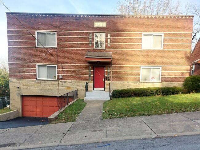 2 units use garage, 2 units street parking - 3731 Dunkirk St