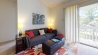 This single-story residence located on Prince David Drive in Richmond, Virginia, offers a well-organized layout spanning multiple rooms designed for comfortable everyday living. The living room serves as a welcoming central space, featuring neutral walls, a textured ceiling, and a large sliding glass door with vertical blinds that allows natural light to fill the room.

The kitchen is outfitted with white cabinetry, ample counter space, a dishwasher, and a range, all complemented by a bold black-and-white checkered tile floor that adds a classic visual contrast. Adjacent to the kitchen, the dining area features carpeted flooring and is anchored by a pendant light overhead, with an open sightline connecting to surrounding spaces.

The bedrooms are carpeted and offer a calm, restful atmosphere. Each room includes windows with blinds that provide views of the surrounding greenery, allowing natural light throughout the day. The bathrooms are clean and functional, each featuring a tub-shower combination, white cabinetry with integrated storage, a vanity mirror, and tile flooring. The overall ambiance of the residence is practical and bright, with a neutral palette that creates a cohesive feel throughout.