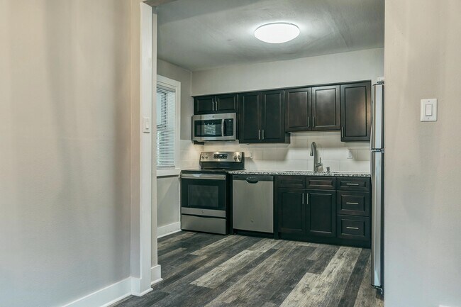 Kitchen features Granite Counters, Custom Cabinets and Stainless Steel Appliances - 1254 Hafner Pl