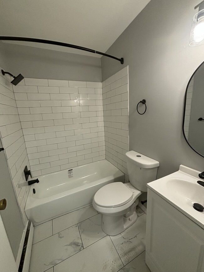 Updates bathroom in 1-bedroom - Prescott Arms Apartments