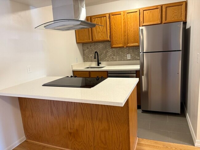 Foto del edificio - Spacious & Stylish 1-Bedroom Condo in the ...