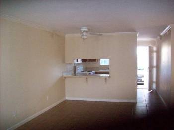 3 bd; See through kitchen window from living room in 3 bedroom - Lantana Village Apartments