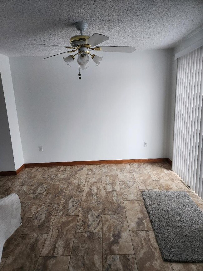 Dining Room with sliding glass room to deck. Vertical blinds. - 6568 Ward Rd