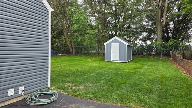 Enjoy a private backyard, ideal for relaxing or entertaining. The space includes a secure storage sh - 604 Holly Ln