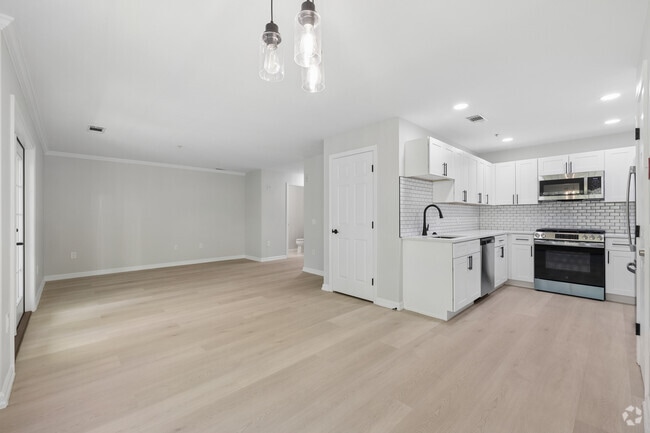 2BR, 2.5BA - 1,388SF - Kitchen and Living Room - The White Oaks