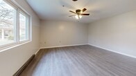 This 510 square foot apartment, situated at 355 S Main St in Albion, NY, offers a well-designed living space with two bedrooms and one bathroom. The single-story layout maximizes efficiency, with the primary bedroom boasting a generous 220 square feet. Throughout the apartment, modern grey wood-look flooring creates a cohesive and contemporary aesthetic.

The kitchen showcases a blend of functionality and style, featuring white upper cabinets paired with natural wood lower cabinets. Stainless steel appliances, including a professional-grade range and hood, elevate the culinary experience. The bathroom is equipped with essential amenities, including a bathtub with shower, and accessibility features such as grab bars.

Both bedrooms offer ample space, with one room featuring a ceiling fan for added comfort. Windows in the bedrooms provide natural light and views of the surroundings. The living areas are bright and airy, with neutral-toned walls that allow for personalization. Thoughtful details like baseboard heating ensure year-round comfort in this compact yet well-appointed apartment.