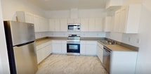 This contemporary 760 square foot apartment in Moses Lake, WA, offers a harmonious blend of style and functionality. The space boasts a single bedroom spanning 240 square feet, complemented by one bathroom. The apartment's most striking feature is its stunning marble-effect flooring, which flows seamlessly throughout, creating a sense of luxury and continuity.

Large windows dominate the living areas, flooding the space with natural light and offering views of the surrounding neighborhood. A private balcony, accessible through sliding glass doors, extends the living space outdoors, providing a perfect spot for relaxation or al fresco dining.

The open-concept layout seamlessly integrates the living room, dining area, and kitchen, ideal for modern living and entertaining. The kitchen is a chef's delight, featuring sleek white cabinetry, stainless steel appliances, and ample counter space. A built-in microwave and dishwasher add convenience to this well-appointed culinary space.

The bedroom is generously sized and includes a large closet with sliding doors for optimal storage. The bathroom continues the apartment's modern aesthetic with clean lines and bright, white fixtures. Throughout the apartment, recessed lighting and climate control systems ensure comfort and ambiance.

This turnkey apartment combines contemporary design with practical amenities, offering a perfect urban retreat in the heart of Moses Lake.