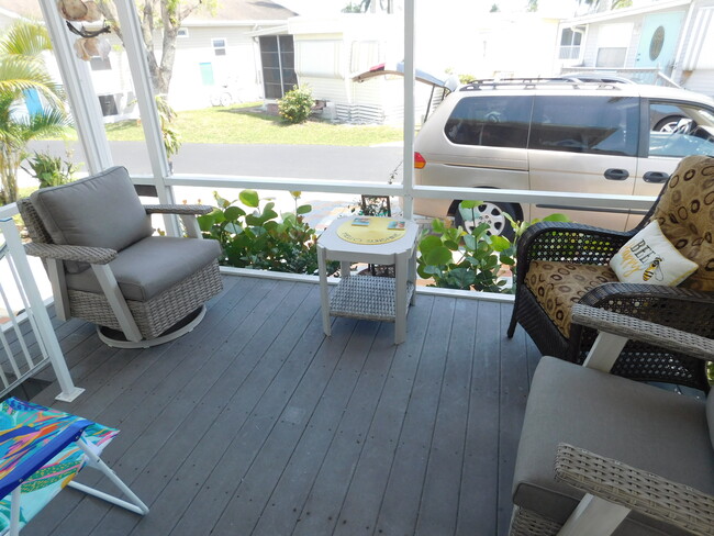 Breezy porch w/New swivel rockers - 16300 Pine Ridge Rd