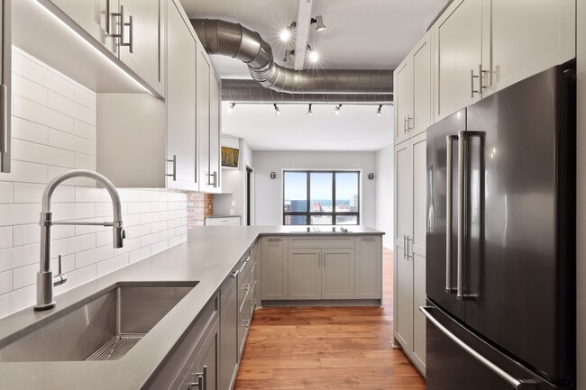 Kitchen with hands free faucet and new built in appliances - 168 6th St E