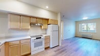 Located at 80 Dovetail Lane in Healdsburg, CA, this three-bedroom, two-bathroom residence offers a well-organized single-floor layout designed for comfortable everyday living. Light wood-tone flooring runs consistently throughout the home, creating a cohesive and inviting atmosphere.

The kitchen is thoughtfully equipped with light maple cabinetry, white appliances including a range, refrigerator, and dishwasher, along with a stainless steel sink positioned beneath a window that brings in natural light. Recessed ceiling lighting adds a clean, functional touch to the space.

The three bedrooms feature the same warm wood flooring and neutral wall tones. The primary bedroom offers a sliding closet for storage, while the additional bedrooms include standard closets and windows that allow natural light. The rooms maintain a simple, clean aesthetic with ample wall space.

The two bathrooms are finished with light wood flooring and crisp white walls. One bathroom includes a tub-shower combination with white subway tile surround and a curved curtain rod, while the second features a single-sink vanity with maple cabinetry and a wall mirror. Both bathrooms are neatly appointed and functional.

The overall interior presents a clean, modern sensibility with neutral tones and consistent finishes throughout, making it a versatile and move-in ready home in the heart of Healdsburg.