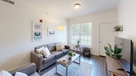 Located at 202 Onley Rd in Salisbury, Maryland, this single-floor residence offers five bedrooms and four bathrooms within a well-organized layout. The open kitchen and living area serves as the heart of the home, featuring warm wood cabinetry, granite countertops, stainless steel appliances, and a breakfast bar peninsula that connects seamlessly to the living room. The living room is bright and welcoming, with large windows fitted with horizontal blinds that allow ample natural light and views of the surrounding greenery. Hardwood-style flooring runs throughout the unit, adding warmth and visual continuity across every room. The galley-style kitchen also provides direct access to an in-unit laundry area, adding a practical convenience. Each of the five bedrooms is a comfortable, well-lit space with windows overlooking outdoor views, and several rooms include built-in shelving or desk nooks, making them well-suited for both rest and study. The four bathrooms are consistently appointed with granite-topped vanities, warm wood cabinetry, and tub-shower combinations with clean, white curtains. Crown molding and textured ceilings add architectural detail throughout. A central hallway connects all rooms efficiently, completing this thoughtfully designed multi-bedroom residence.