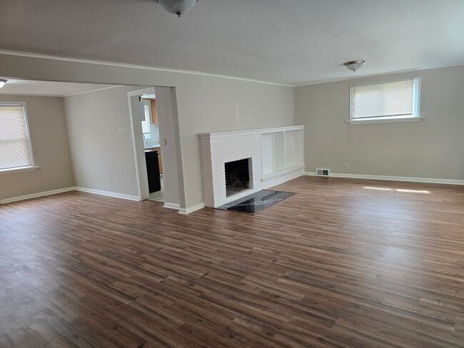 Living & dining rooms w/ new flooring thru-out. - 12105 12th Ave S