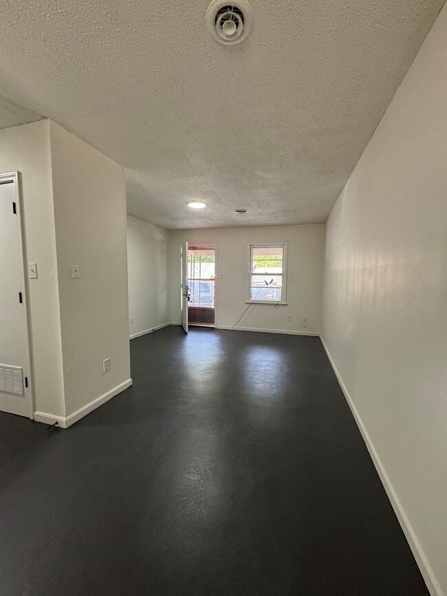 Building Photo - This freshly repainted and refreshed single-story brick duplex- End Unit