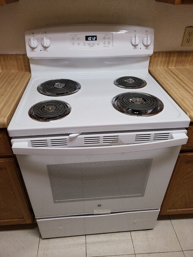 New electric range - 6500 Sands Point Dr