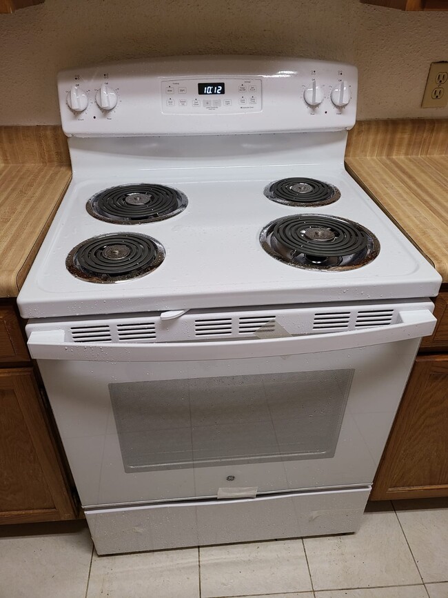 New electric range - 6500 Sands Point Dr