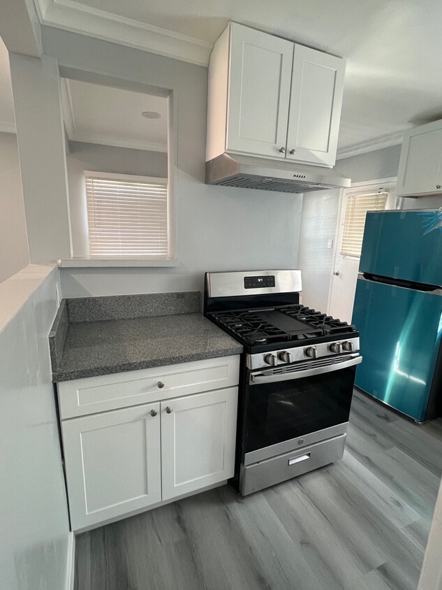 new refrigirator, the the pl;astic cover will be removed - 2293 Grand Ave