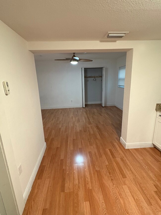 View from the kitchen into the main room - 10918 N Hyacinth Ave