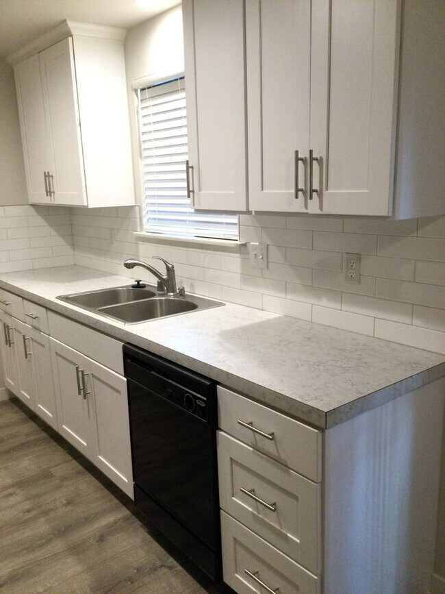 Building Photo - Updated side by side duplex with an attach...